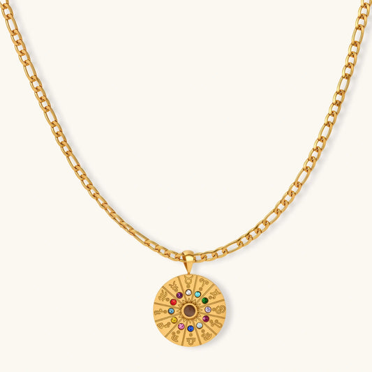 Gold-tone zodiac wheel pendant with 12 colorful cubic zirconia stones on a figaro chain, 18K gold plated stainless steel.